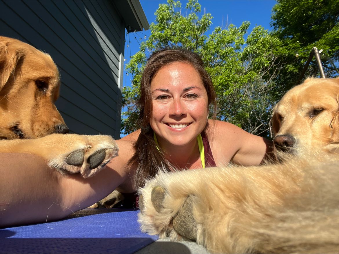 Patty Beck doing yoga with her dogs